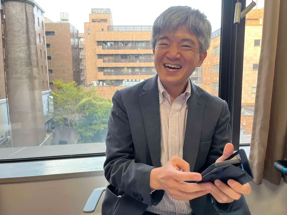 Professor playing with the SpeakBuddy app